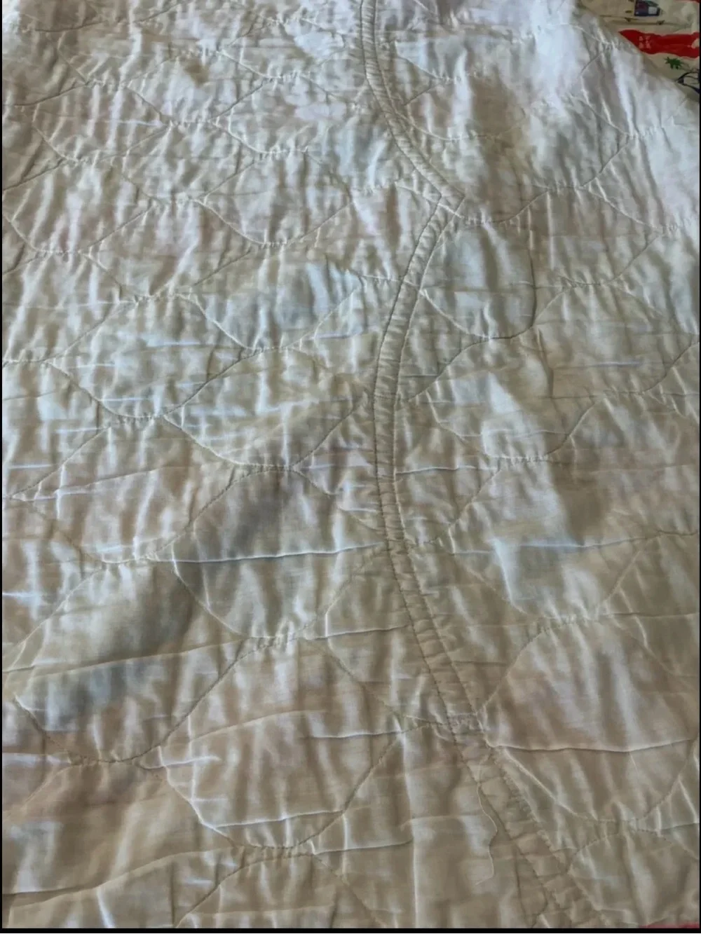 Vintage Marine Paradise quilted blanket featuring a colorful red and cream novel